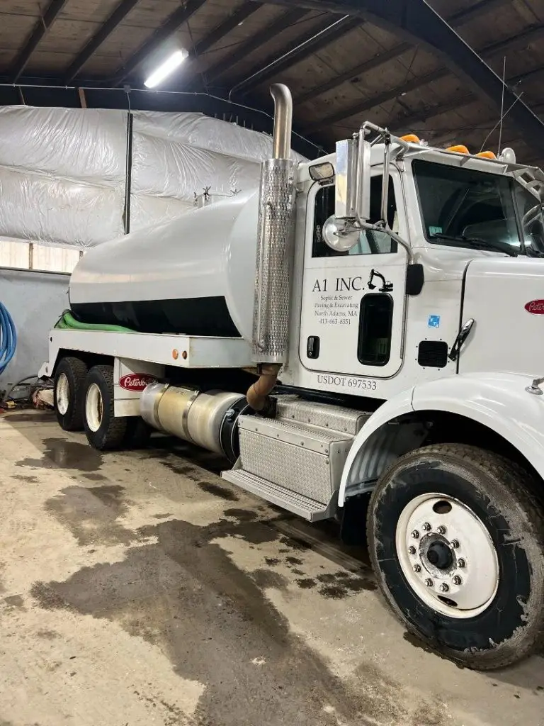 A1 Inc. septic pumping truck in the garage